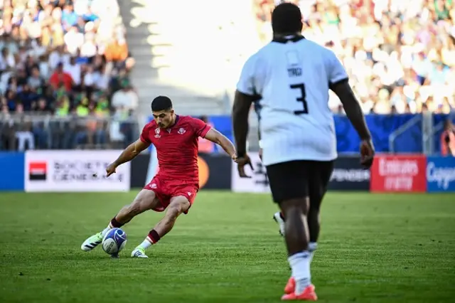 Luka Matkava  kicks the ball for a penalty conversion