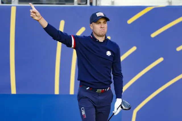 Justin Thomas points after an errant tee shot