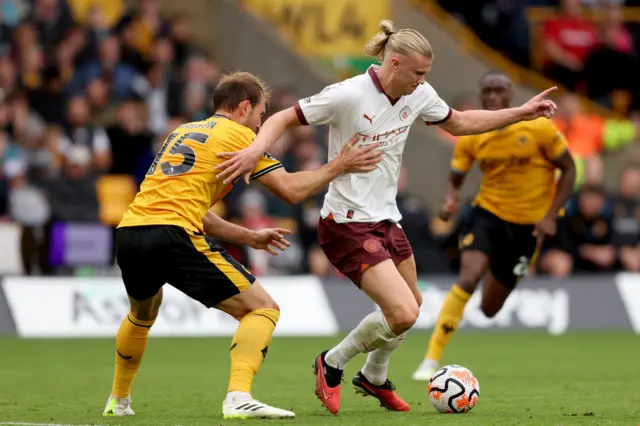 Craig Dawson and Erling Haaland