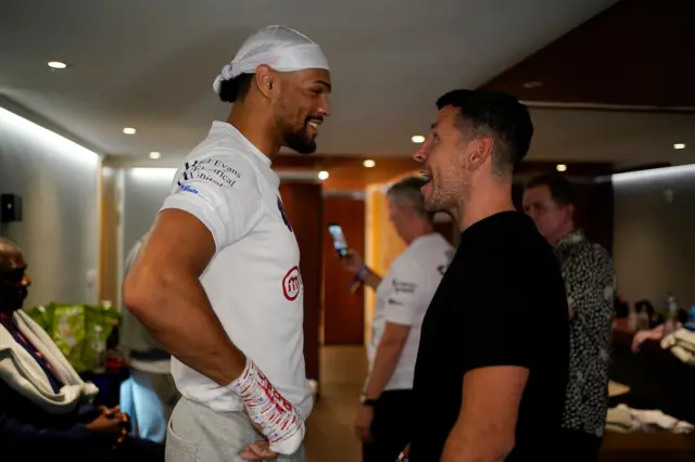 Jordan Thompson laughs with Darren Barker