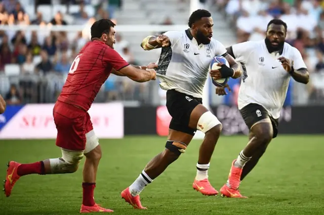 Fiji's flanker Lekima Tagitagivalu runs with the ball