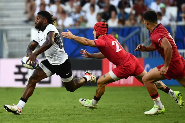 Fiji's wing Selestino Ravutaumada runs with the ball