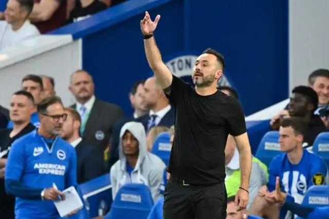 De Zerbi shouts and waves instructions to his players from the sideline.