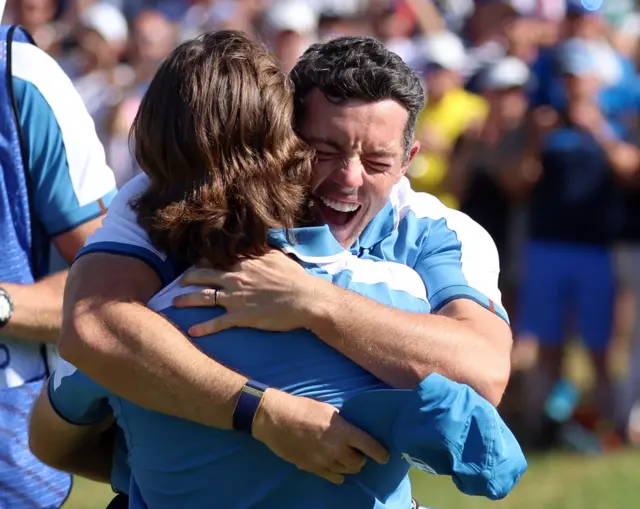 Tommy Fleetwood and Rory McIlroy embrace after winning their Ryder Cup foursomes match