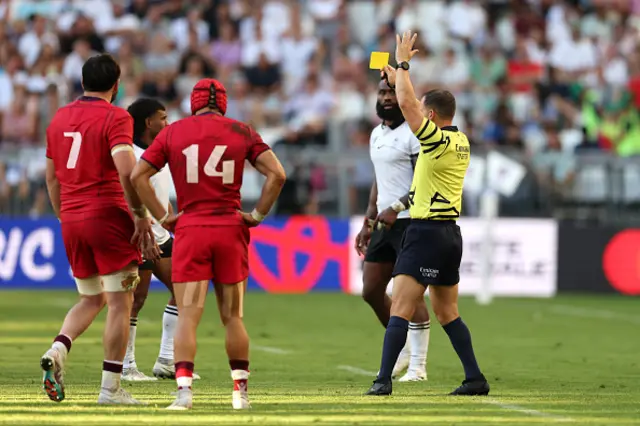 Semi Radradra of Fiji (obscured) is shown a yellow card