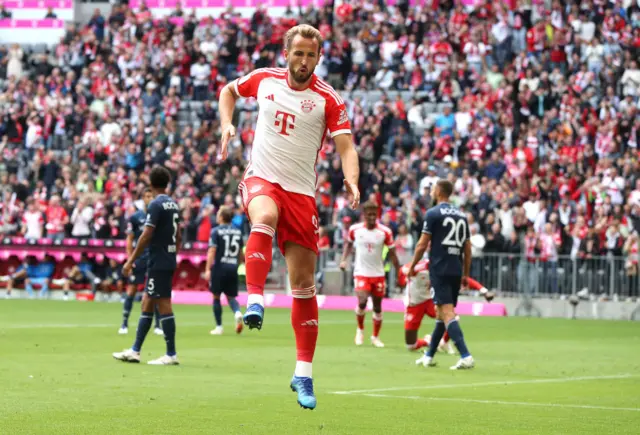 Harry Kane celebrates after scoring for Bayern Munich