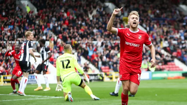 Swindon's Jake Cain celebrates scoring against Grimsby