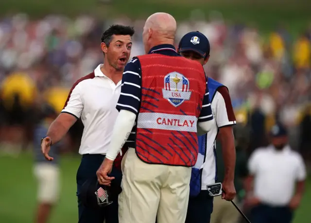 Rory McIlroy exchanges words with Patrick Cantlay's caddie