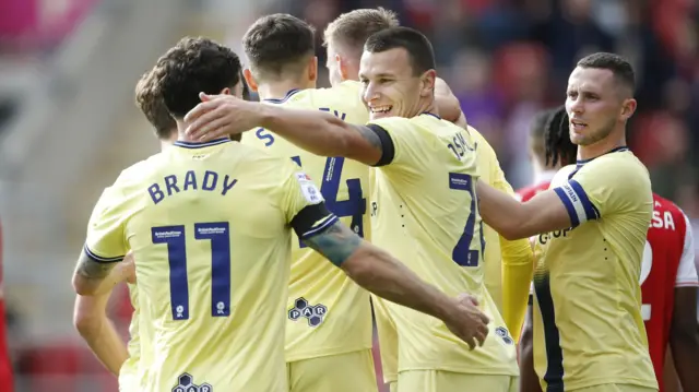 Preston players celebrate a goal against Rotherham