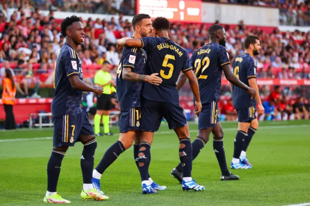 Joselu celebrates with Jude Bellingham after scoring for Real Madrid against Girona.