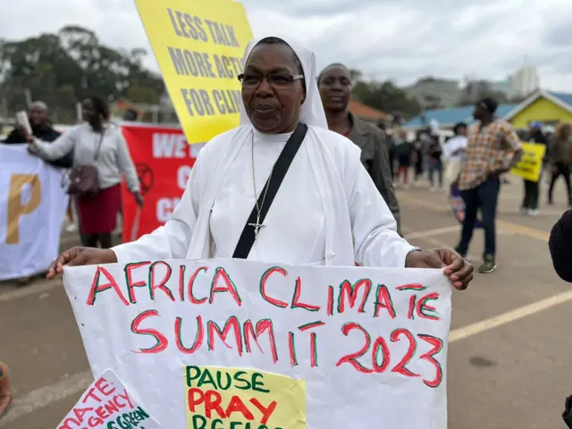 Woman holding a placard