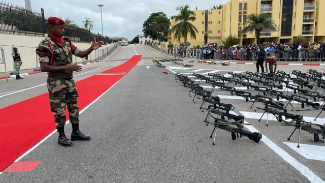 Soldier pointing at guns