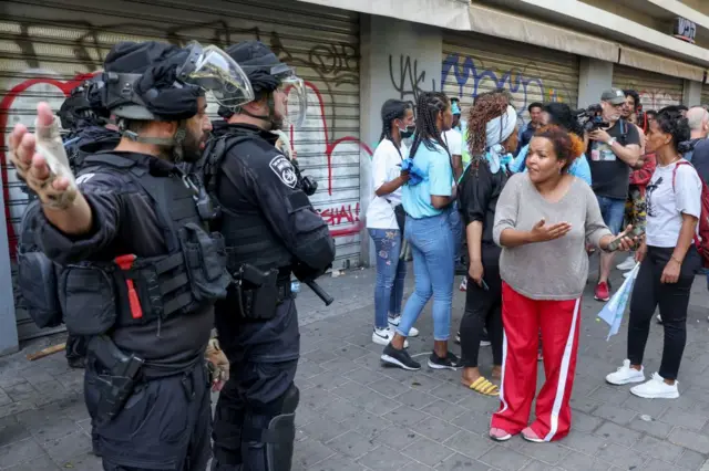 Members of Israel's security forces disperse Eritrean asylum-seekers protesting an event organised by Eritrea's government in the coastal city of Tel Aviv on September 2, 2023.