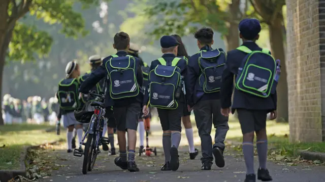 Students are on their way to school in the first day of new term, 5 September 2023