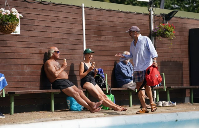 People in Cambridge cooled off at an outdoor swimming pool in the city to stave off unusually high temperatures