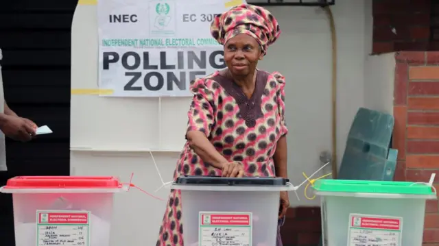 A woman casts her ballot at a polling station during the general elections in Nigeria