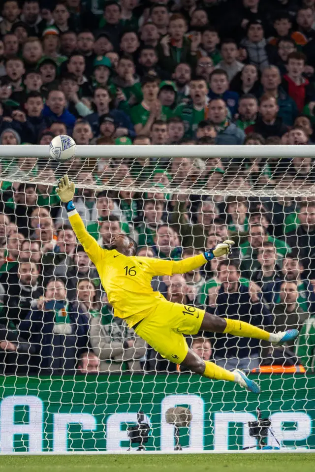 Mike Maignan makes a save against the Republic of Ireland