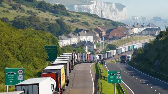 Lorries queue for the Port of Dover along the A20 in Kent