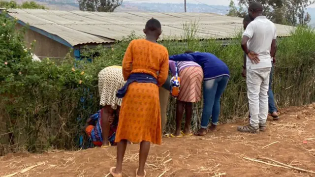 People looking at home of suspected serial killer in Kigali, Rwanda