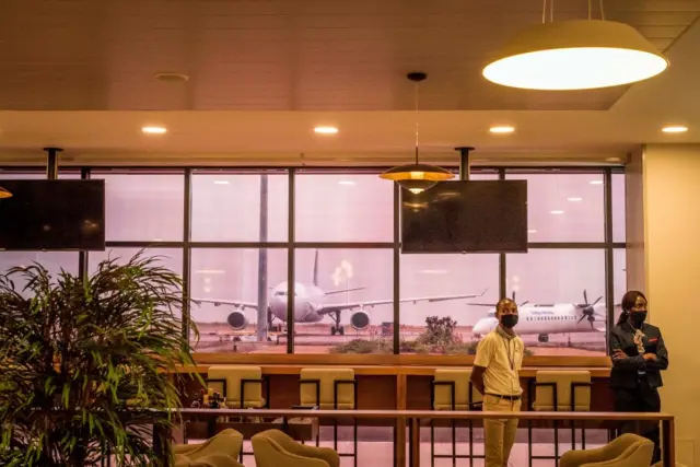 Airport employee wait for passengers in the departure lounge of the N'Djili International Airport in Kinshasa - August 2020