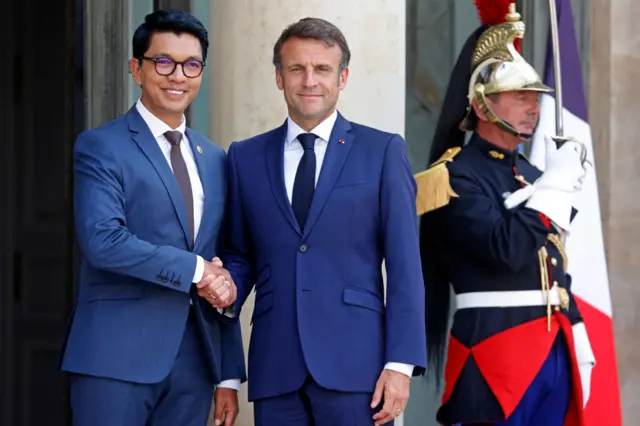 France's President Emmanuel Macron (R) welcomes Madagascar's President Andry Rajoelina (L) prior to a meeting at Elysee Palace on June 09, 2023 in Paris, France