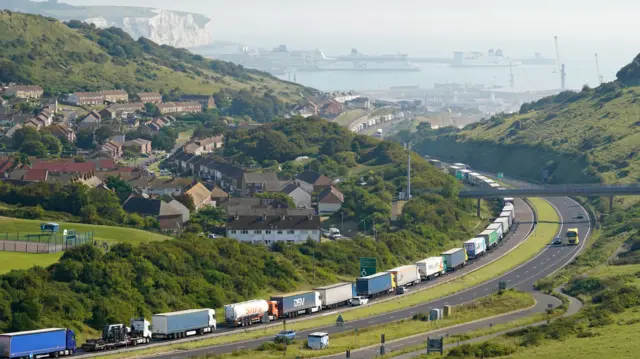 Lorries queue for the Port of Dover along the A20 in Kent