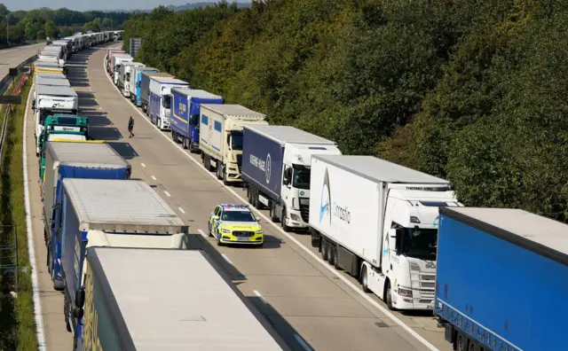 Lorries queue for the Port of Dover along the M20 near Ashford in Kent as security checks are being carried