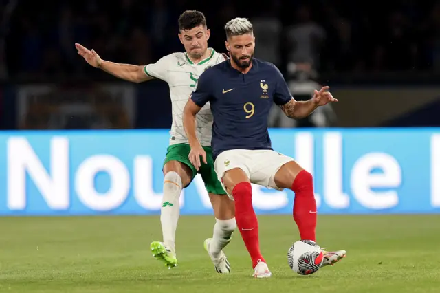 John Egan in action against Olivier Giroud