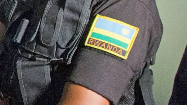 Close-up of a Rwandan security officer's badge at the RBI HQ in Kigali, Rwanda - 2019