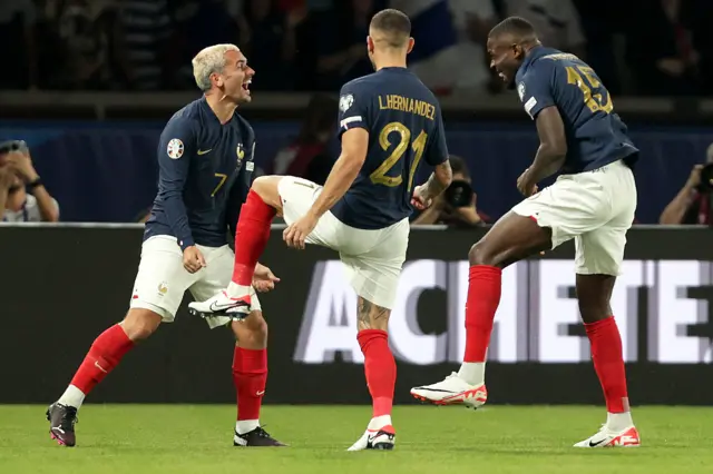 Marcus Thuram celebrates scoring his side’s second goal with Antoine Griezmann and Lucas Hernandez