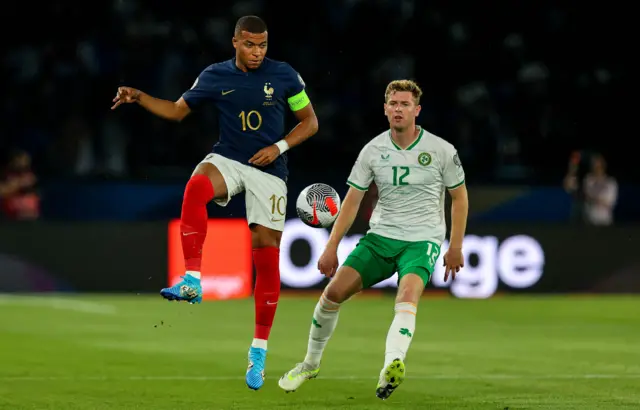 Kylian Mbappé in action against Nathan Collins