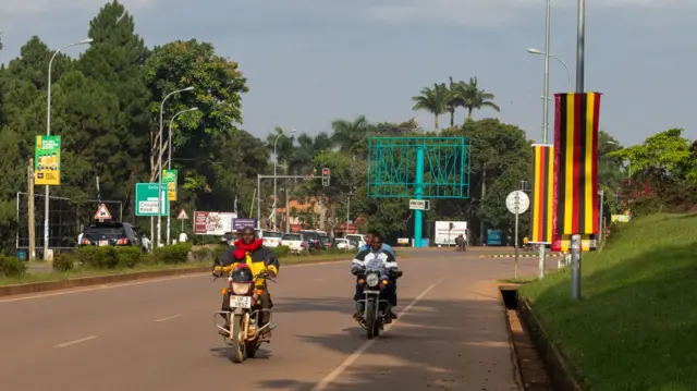 Uganda and Iran welcoming flags are seen on the ring fence of the Ugandan State House in Entebbe on July 12, 2023 as Ugandan President Yoweri Museveni prepares to welcome the Iranian president Ebrahim Raisi for a state visit to Uganda on July 12, 2023.