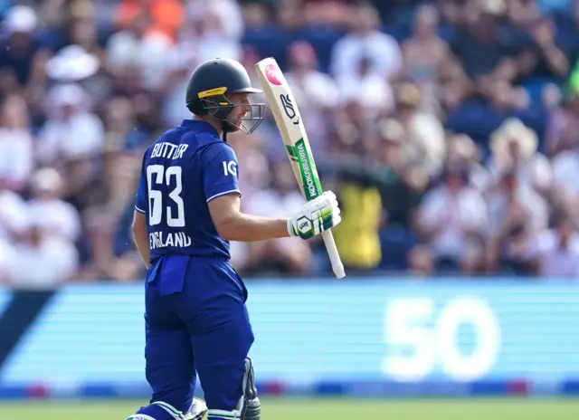 Jos Buttler celebrates his half-century