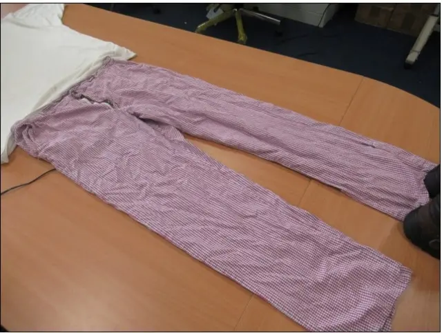 Red and white check trousers laid out on a table