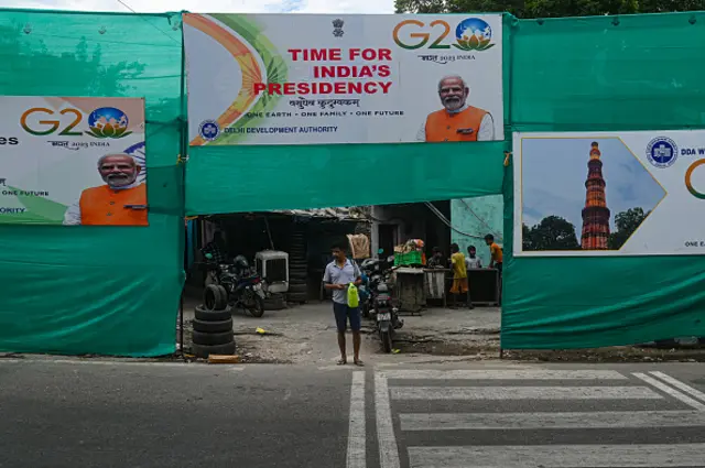 A man stands in front of the hoardings of the G20 Summit, ahead of the G20 Summit in New Delhi, India on September 6, 2023. India will host the 18th G20 Summit from September 9-10 in New Delhi.