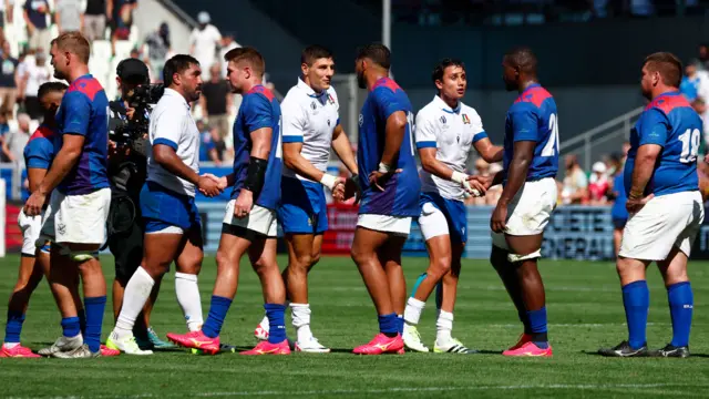 Italy and Namibia players shake hands