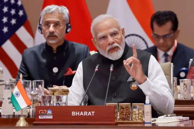 India's Prime Minister Narendra Modi (C) speaks during the first session of the G20 Leaders' Summit at the Bharat Mandapam in New Delhi on September 9, 2023.