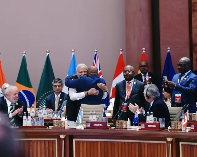Modi hugs African Union chair and Comoros President Azali Assoumani