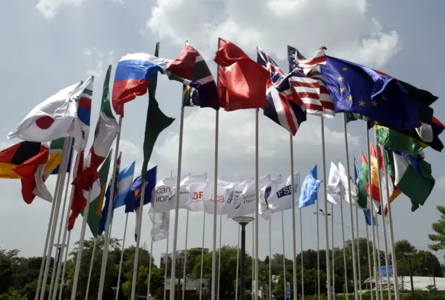 Flags of participating countries wave outside Bharat Mandapam