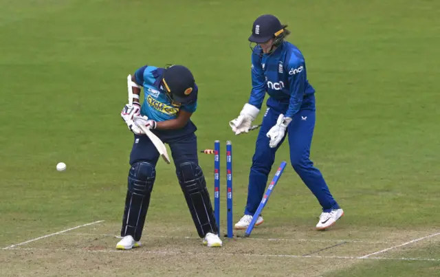 Achini Kulasuriya is bowled by Sarah Glenn