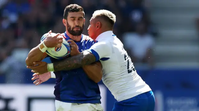Namibia player tackled by Italy