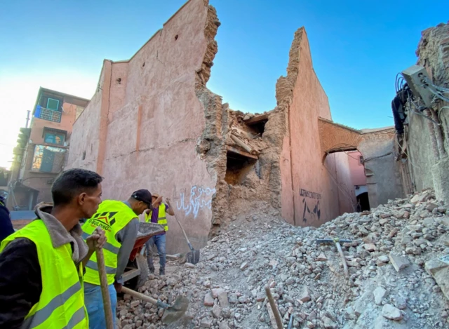 Rescue people work next to damage in the historic city of Marrakech, 9 September 2023
