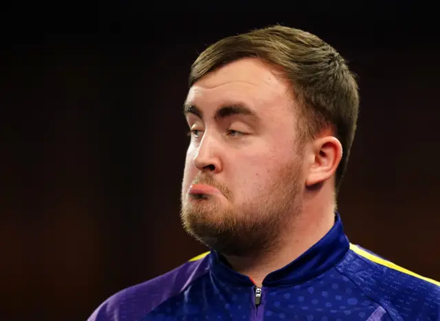 Luke Littler with his bottom lip out