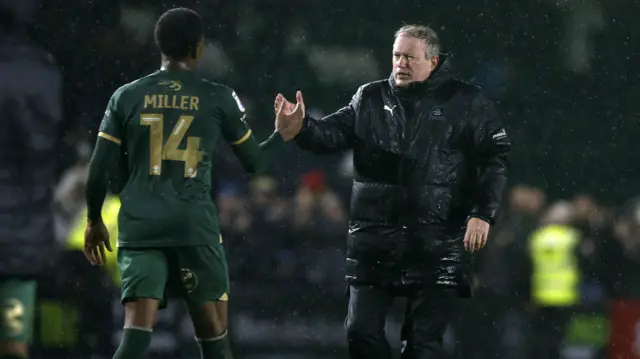 Neil Dewsnip shakes hands