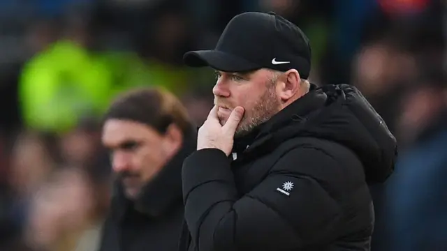 Wayne Rooney rubs chin