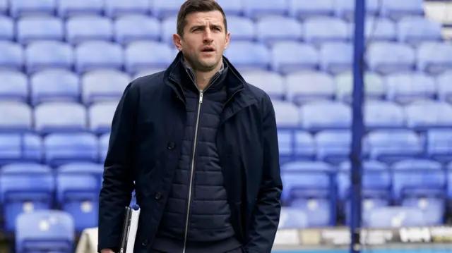 Portsmouth head coach John Mousinho arrives at Fratton Park