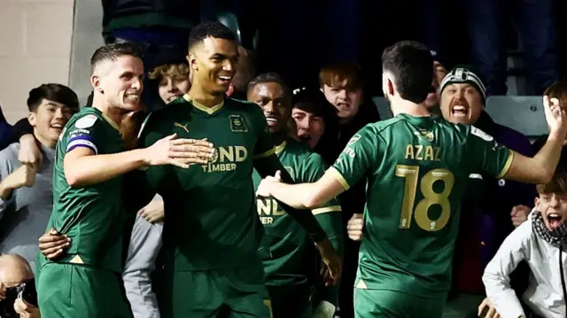 Plymouth players celebrate scoring against Birmingham
