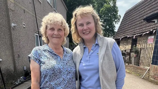 Jo Hamilton standing next to actor Monica Dolan