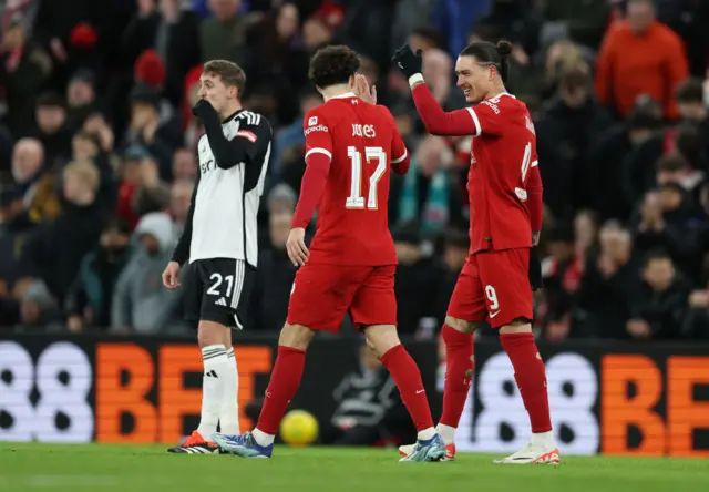 Jones and Nunez celebrate as Castagne commiserates conceding another.