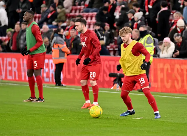 Elliott, Jota and Konate warm up at Anfield.